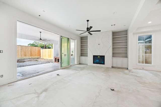 2244 N Blvd, Houston, TX 77098 - unfurnished living room featuring a ceiling fan, built in features, recessed lighting, and a high end fireplace