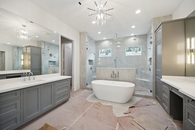 2244 N Blvd, Houston, TX 77098 - full bath featuring a freestanding bath, a notable chandelier, marble finish floor, a shower stall, and vanity