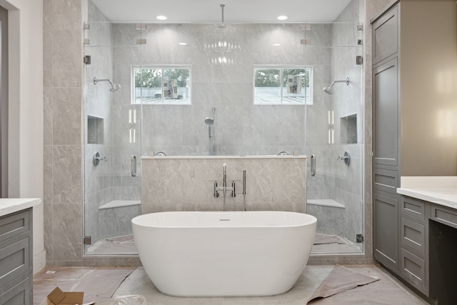 2244 N Blvd, Houston, TX 77098 - full bathroom featuring vanity, marble finish floor, a shower stall, and a freestanding bath