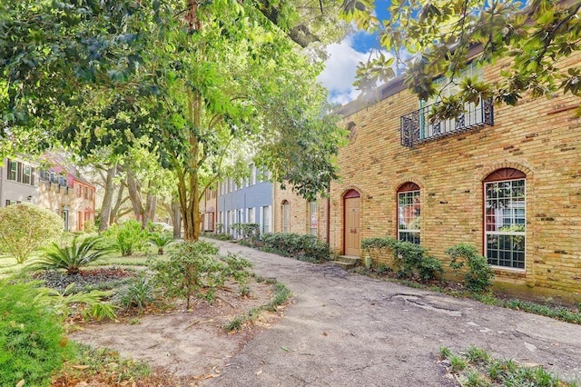 view of property exterior featuring brick siding
