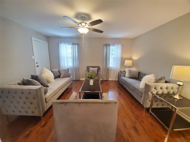 living room featuring dark wood finished floors and ceiling fan