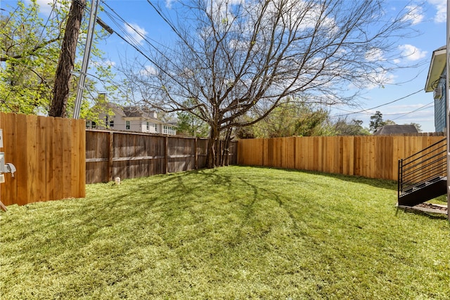 view of yard featuring a fenced backyard