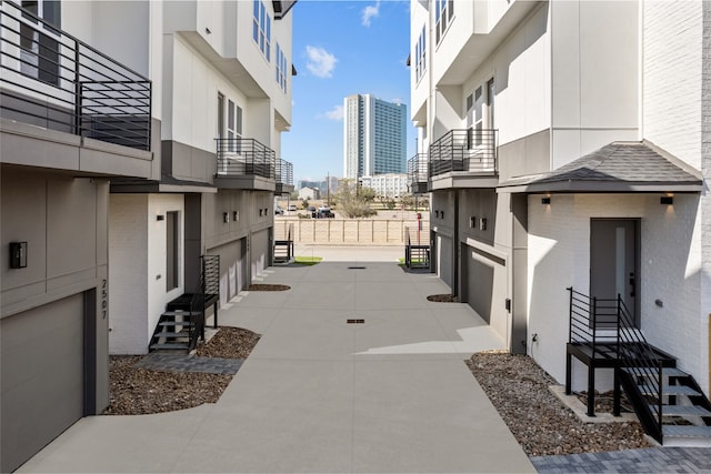 view of street featuring entry steps and a view of city