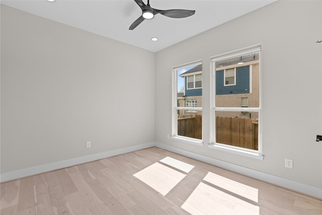 empty room with recessed lighting, ceiling fan, baseboards, and wood finished floors
