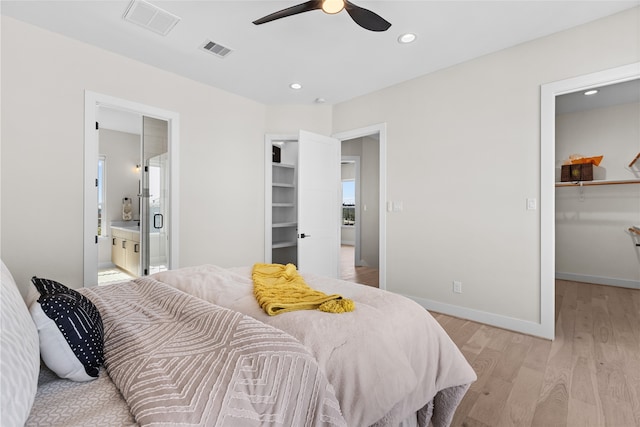 bedroom featuring visible vents, recessed lighting, a spacious closet, light wood-style floors, and a closet