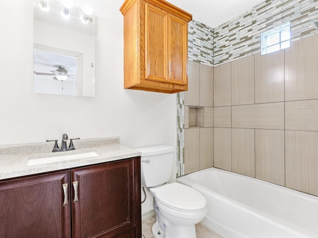 bathroom with toilet, vanity, and ceiling fan