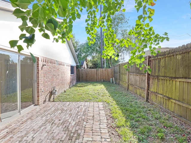 view of yard featuring a fenced backyard and a patio area