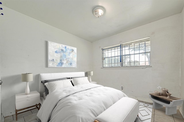 bedroom featuring light tile patterned floors