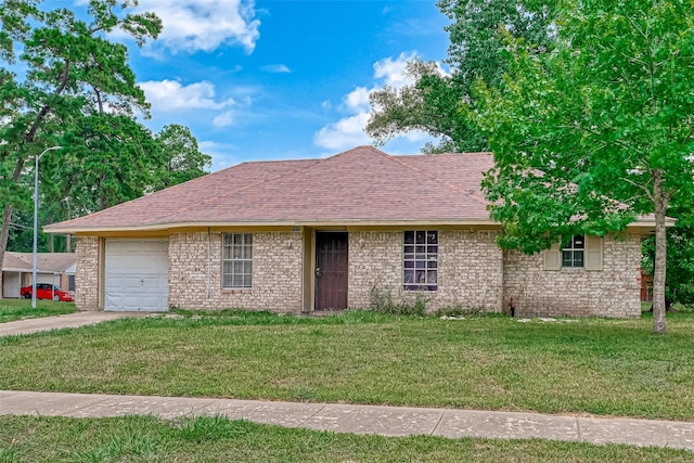 ranch-style house with concrete driveway, a front yard, a garage, and a shingled roof