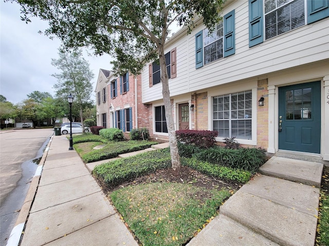 exterior space with brick siding