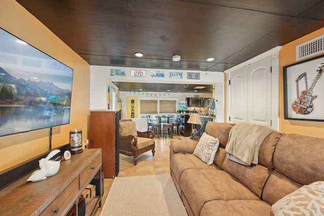 living area featuring visible vents