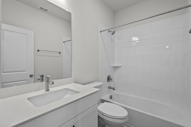 bathroom with visible vents, shower / bathtub combination, toilet, and vanity