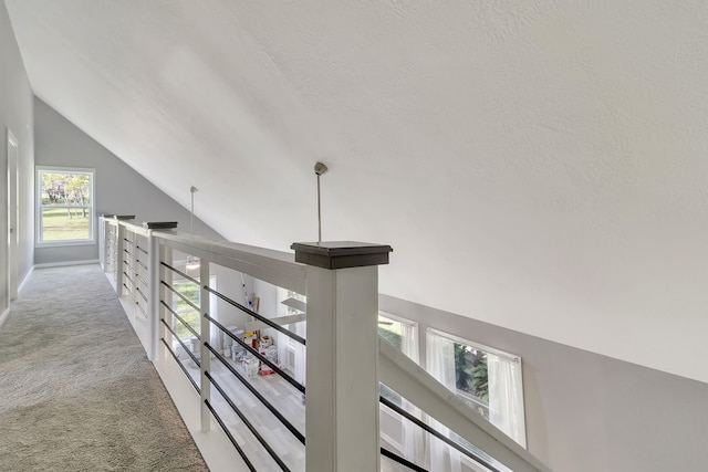 71 Deer Run Cir, Coldspring, TX 77331 - corridor with vaulted ceiling, carpet, and an upstairs landing