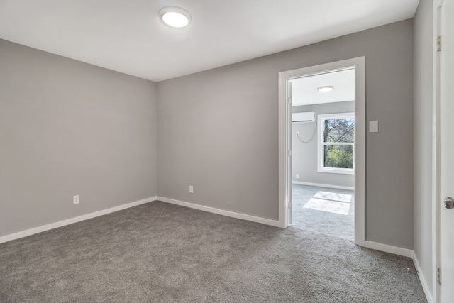 71 Deer Run Cir, Coldspring, TX 77331 - spare room featuring an AC wall unit, carpet, and baseboards