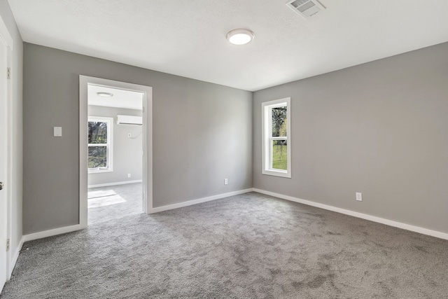 71 Deer Run Cir, Coldspring, TX 77331 - carpeted spare room with an AC wall unit and baseboards