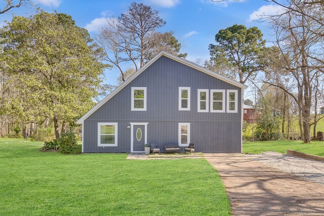 71 Deer Run Cir, Coldspring, TX 77331 - rear view of house featuring a yard