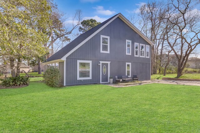 71 Deer Run Cir, Coldspring, TX 77331 - back of house with a lawn and a patio