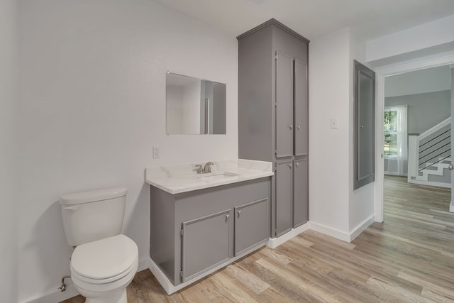 71 Deer Run Cir, Coldspring, TX 77331 - bathroom featuring vanity, wood finished floors, toilet, and baseboards