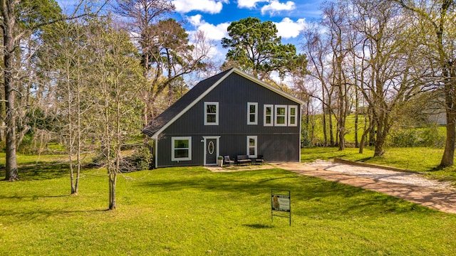 71 Deer Run Cir, Coldspring, TX 77331 - back of house with a lawn and a patio