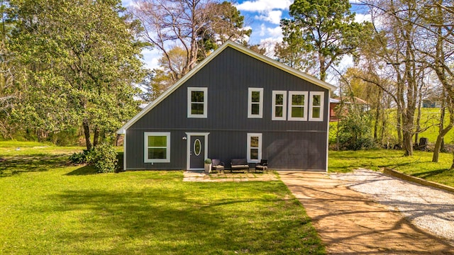 71 Deer Run Cir, Coldspring, TX 77331 - back of house featuring a lawn