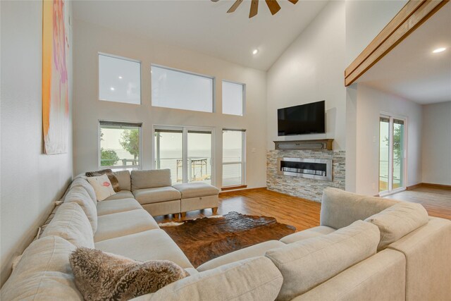 456 S Burnett Dr, Baytown, TX 77520 - living room with recessed lighting, high vaulted ceiling, ceiling fan, a fireplace, and wood finished floors