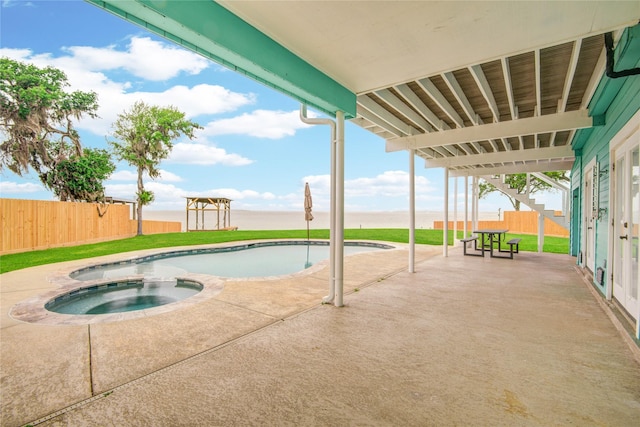 456 S Burnett Dr, Baytown, TX 77520 - view of swimming pool with fence, an in ground hot tub, a yard, and a patio area