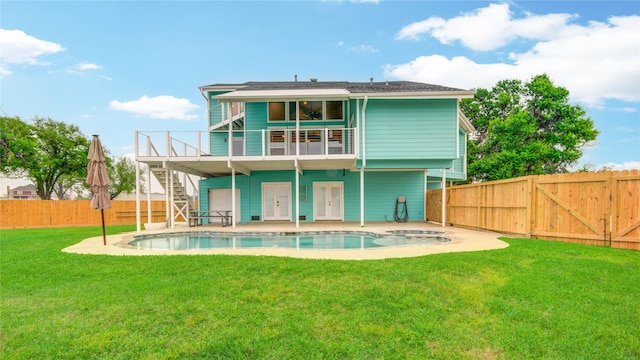 456 S Burnett Dr, Baytown, TX 77520 - back of property featuring a patio area, stairway, a fenced in pool, a fenced backyard, and a lawn