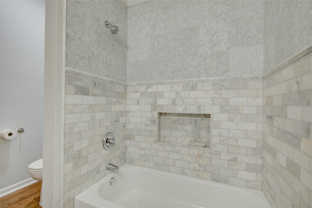456 S Burnett Dr, Baytown, TX 77520 - full bathroom with a tub to relax in, toilet, and wood finished floors