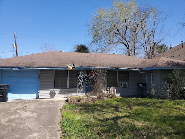 ranch-style house with an attached garage, driveway, and a front lawn