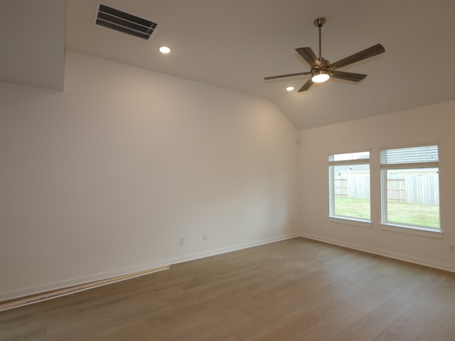 8634 Sun Coral Dr, Cypress, TX 77433 - empty room featuring lofted ceiling, light wood finished floors, ceiling fan, and recessed lighting