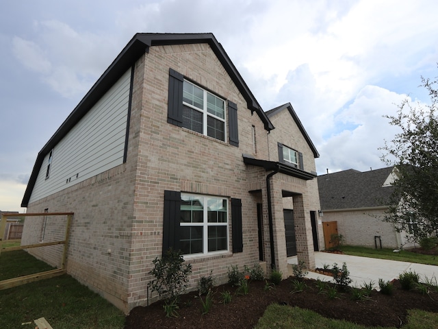 8634 Sun Coral Dr, Cypress, TX 77433 - view of front of home with brick siding, driveway, and a garage