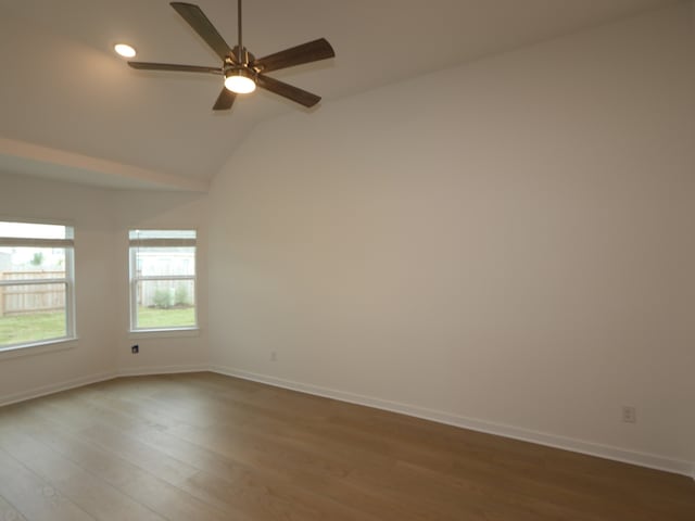 8634 Sun Coral Dr, Cypress, TX 77433 - empty room with wood finished floors, ceiling fan, lofted ceiling, and recessed lighting