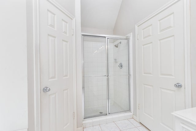 bathroom featuring a shower stall and tile patterned floors