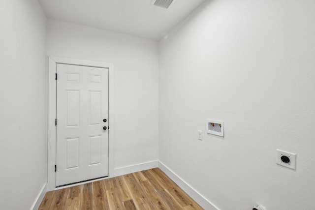 washroom with baseboards, light wood-type flooring, washer hookup, laundry area, and hookup for an electric dryer