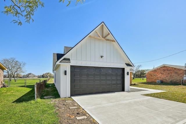 detached garage featuring fence