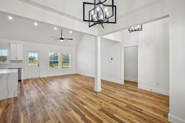 unfurnished living room featuring recessed lighting, baseboards, and light wood-style floors