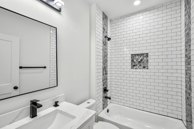 full bathroom featuring toilet, vanity, and bathtub / shower combination