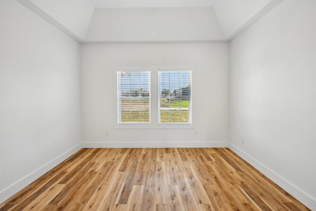 unfurnished room featuring baseboards and light wood-style flooring