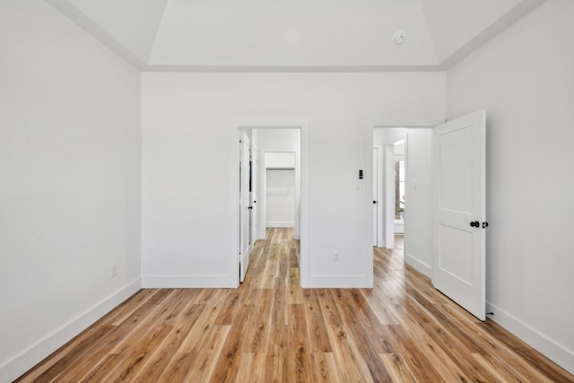 unfurnished bedroom featuring baseboards and light wood-style floors