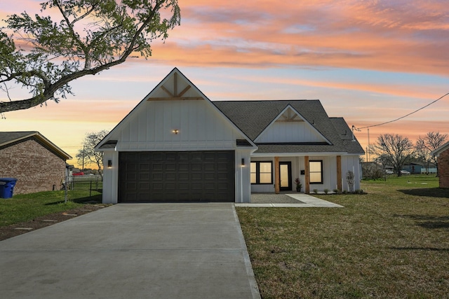 modern farmhouse featuring board and batten siding, a front lawn, roof with shingles, a garage, and driveway