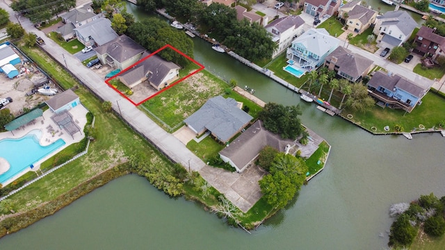 89 Bayou Ln, Kemah, TX 77565 - aerial view of residential area featuring property boundaries highlighted and a large body of water