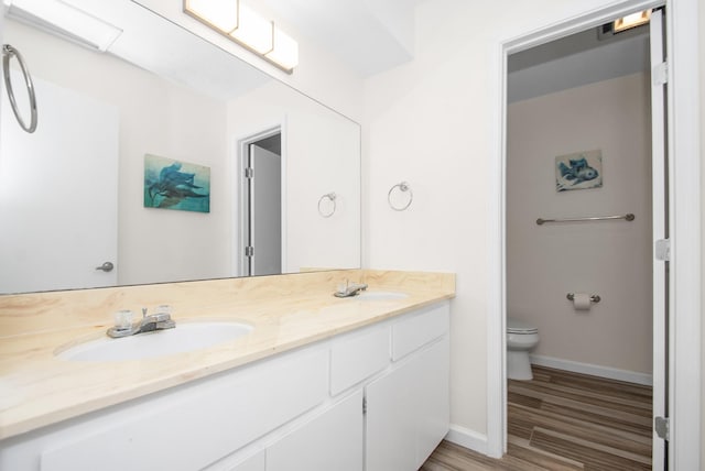 89 Bayou Ln, Kemah, TX 77565 - bathroom with double vanity and wood finished floors