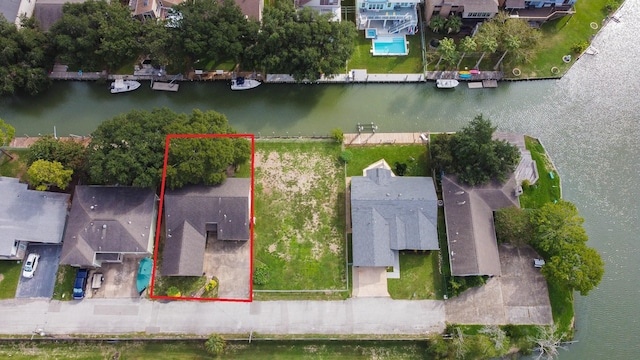 89 Bayou Ln, Kemah, TX 77565 - aerial view of residential area with a large body of water and property parcel outlined