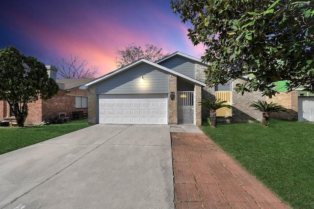 547 Walston Ln, Houston, TX 77060 - view of front of property featuring driveway, brick siding, a lawn, and a garage