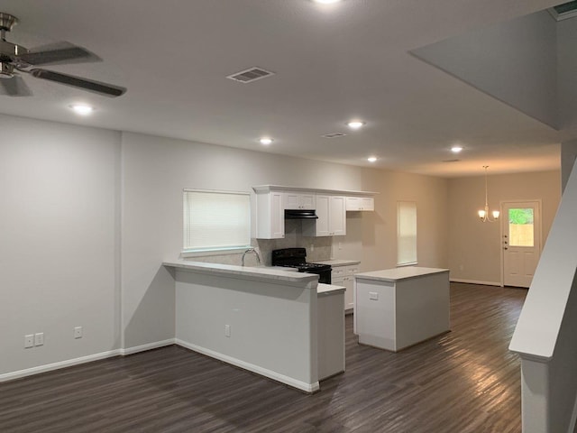 kitchen featuring visible vents, black range with electric cooktop, dark wood finished floors, light countertops, and white cabinets