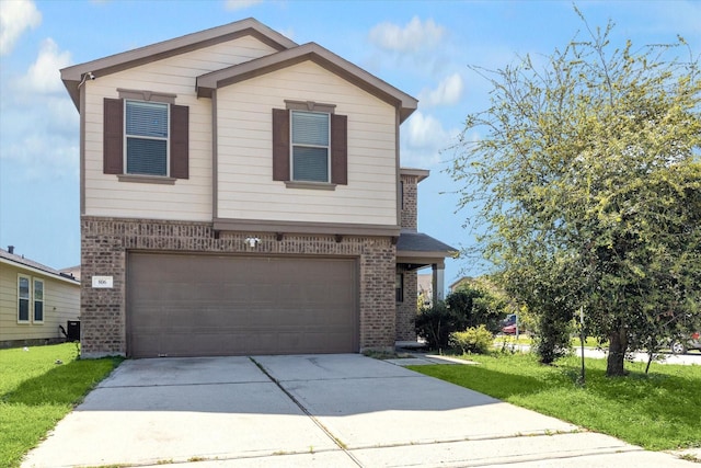 806 Sun Lodge Dr, Houston, TX 77073 - view of front of house featuring driveway, a front yard, a garage, and brick siding