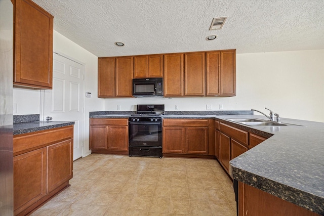 806 Sun Lodge Dr, Houston, TX 77073 - kitchen featuring a sink, visible vents, black appliances, and brown cabinets