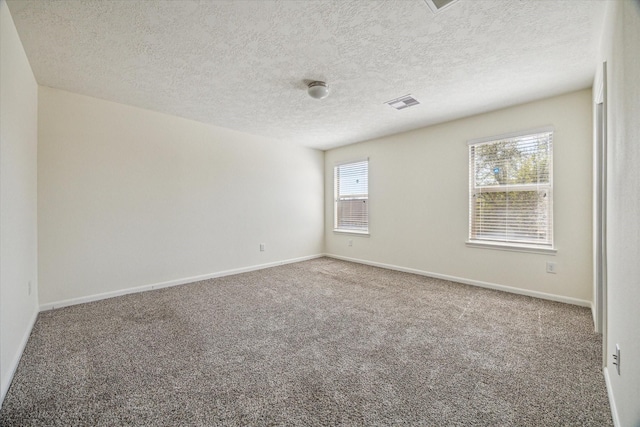 806 Sun Lodge Dr, Houston, TX 77073 - unfurnished room with baseboards, carpet flooring, a textured ceiling, and visible vents