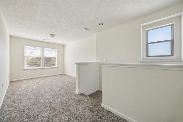 806 Sun Lodge Dr, Houston, TX 77073 - carpeted spare room with baseboards, visible vents, and a textured ceiling
