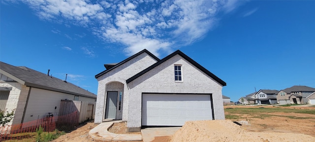 4314 Maple Root Ln, Pinehurst, TX 77362 - french provincial home with brick siding, a garage, and fence